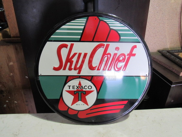 One 23.5 Inch Round Sky Chief Tin Sign.