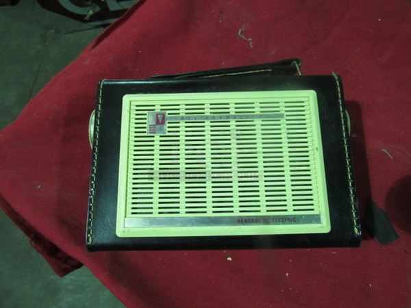 One Vintage GE All Transistor Radio With Handle.