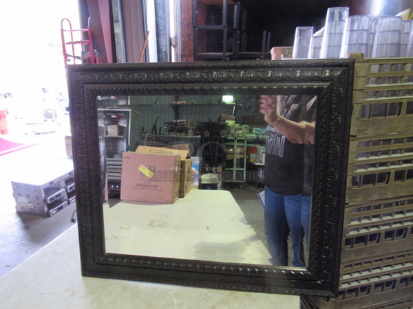 One 25.5X21.5 Framed Mirror.