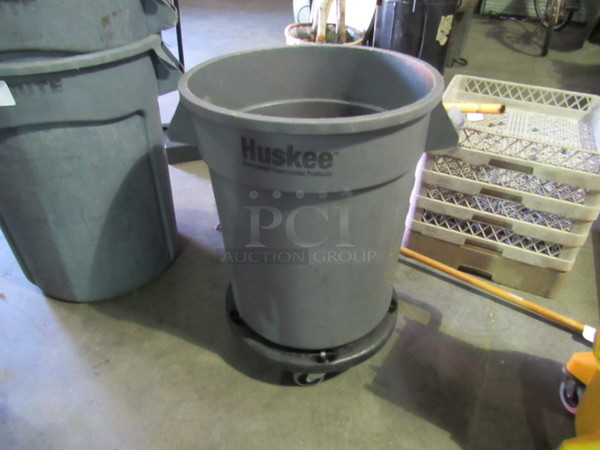 One Huskee Continental Garbage Can.