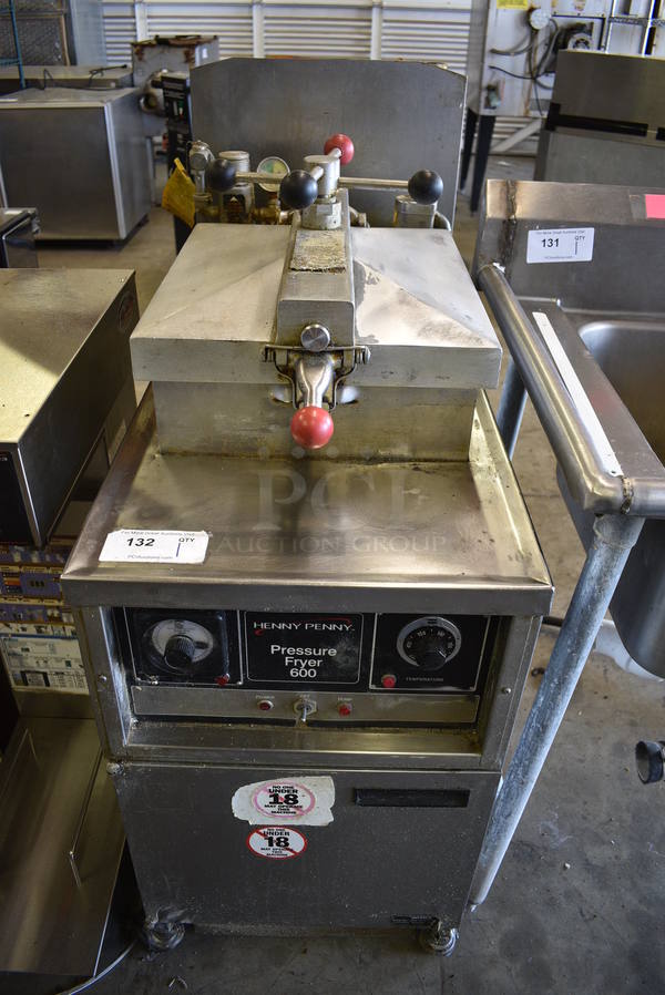 	FANTASTIC! Henny Penny Model 600 Stainless Steel Commercial Natural Gas Powered Pressure Fryer w/ Metal Basket on Commercial Casters. 80,000 BTU. 18x39x49