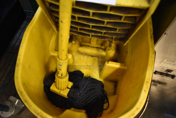 Yellow Poly Mop Bucket w/ Wringing Attachment and Mop on Commercial Casters. 16x23x37 - Image 2 of 3