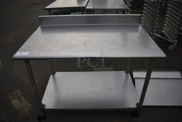 Stainless Steel Table w/ Backsplash and Metal Undershelf on Commercial Casters. 48x30x39 - Image 1 of 4