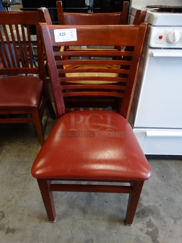 3 Wood Pattern Dining Chairs w/ Horizontal Back Rest Bars and Red Seat Cushion. 19x18x35. 3 Times Your Bid!