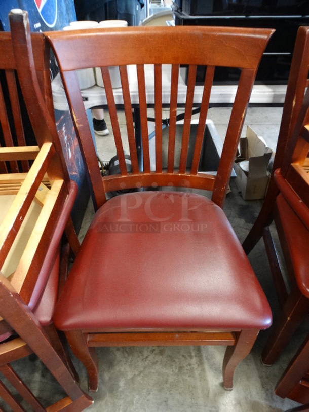 5 Wood Pattern Dining Chairs w/ Vertical Back Rest Bars and Red Seat Cushion. Stock Picture - Cosmetic Condition May Vary. 19x18x35. 5 Times Your Bid!