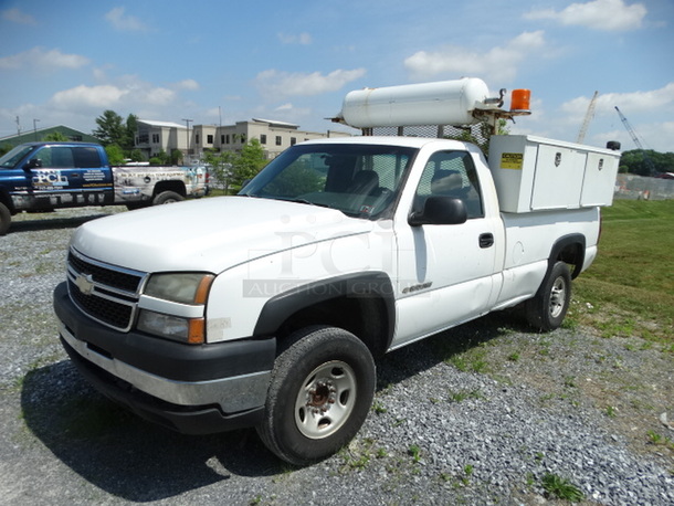 2006 Chevrolet 2500 HD Pick Up Truck w/ Lift Gate, 6 Toolboxes Compartments and Air Compressor. Vehicle Used To Be Used As A Roadside Tire Repair Unit. Odometer Reads 167,327. VIN 1GCHC24U96E173742. Comes w/ Key! Title In Hand. Runs and Drives But Needs New Battery. Unit Has Been Sitting But We Can Jump The Battery When The Winning Bidder Picks Up