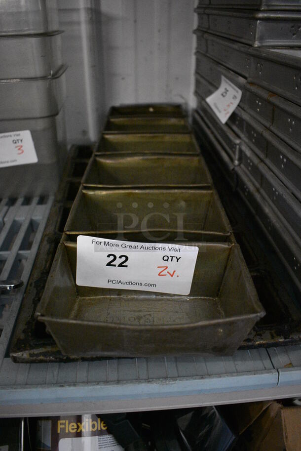 2 Metal Baking Pans. 6 Loaf and 12 Cup. 6x23x2, 9.5x19.5x1.5. 2 Times Your Bid! 