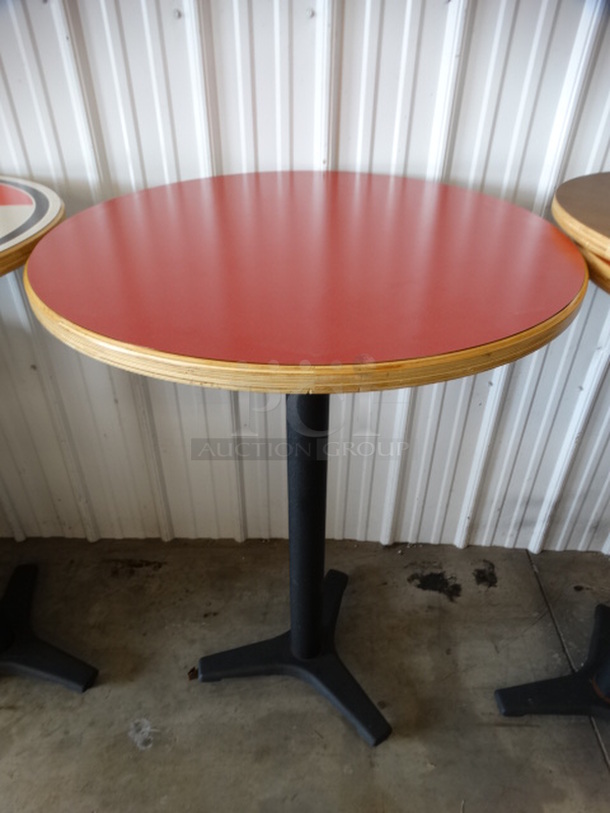 Round Red Bar Height Table on Black Metal Table Base. Stock Picture - Cosmetic Condition May Vary. 30x30x43