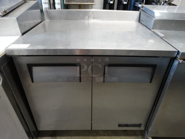 GREAT! 2005 True Model TWT-36 Stainless Steel Commercial 2 Door Work Top w/ Backsplash on Commercial Casters. 115 Volts, 1 Phase. 36.5x30x39.5. Tested and Powers On But Does Not Get Cold