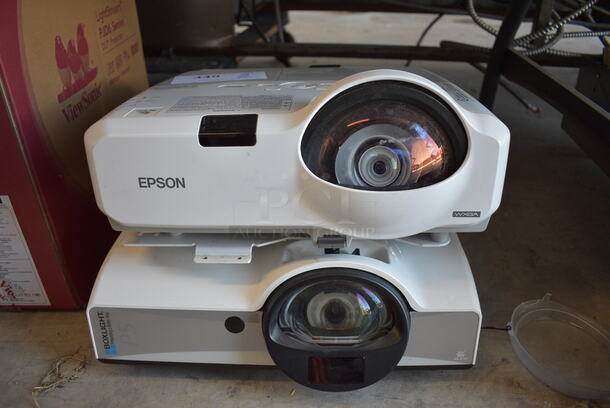 2 Projectors; Epson H448A and Boxlight P5 WX31NST. Includes 13.5x15x7.5. 2 Times Your Bid!