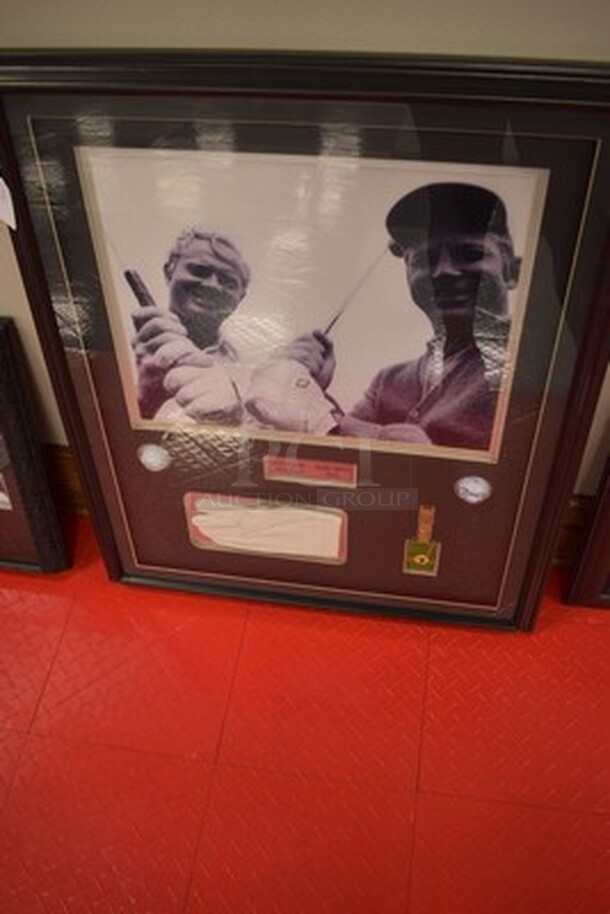 Framed Picture of Jack Nicklaus and Mickey Mantle! Comes With Signed Golf Balls by Jack Nicklaus and Mickey Mantle, Jack Nicklaus's Glove, and Mickey Mantle's Golf Bag Tag. 29x1x35.