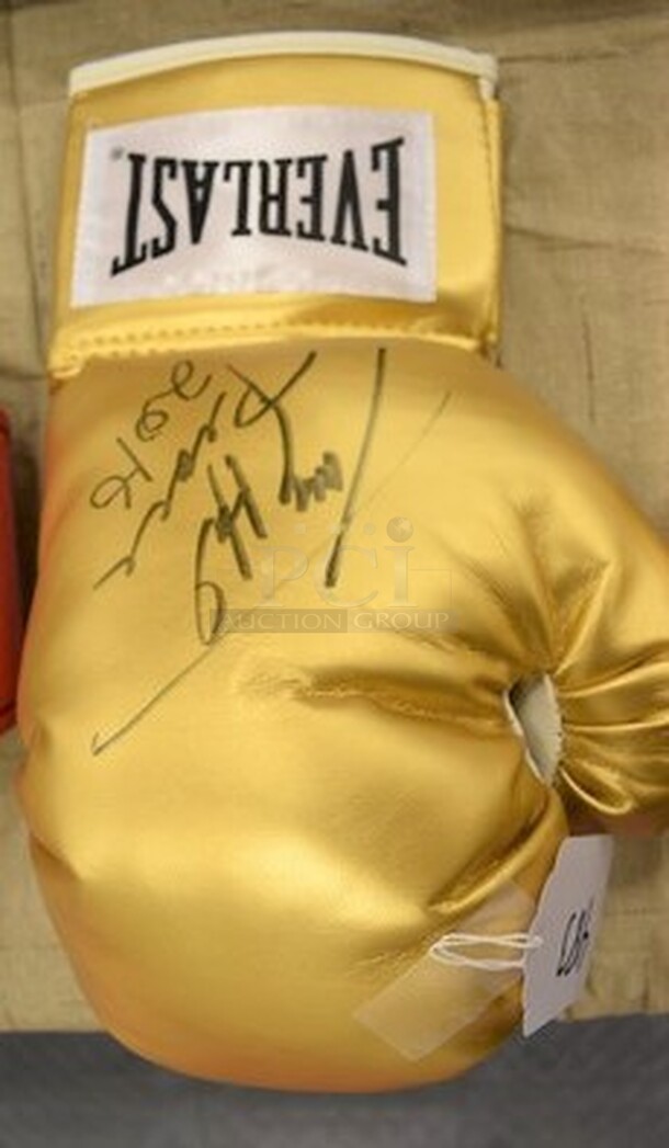 Gold Colored Boxing Glove Signed By Larry Holmes! Comes With Certificate of Authenticity! 