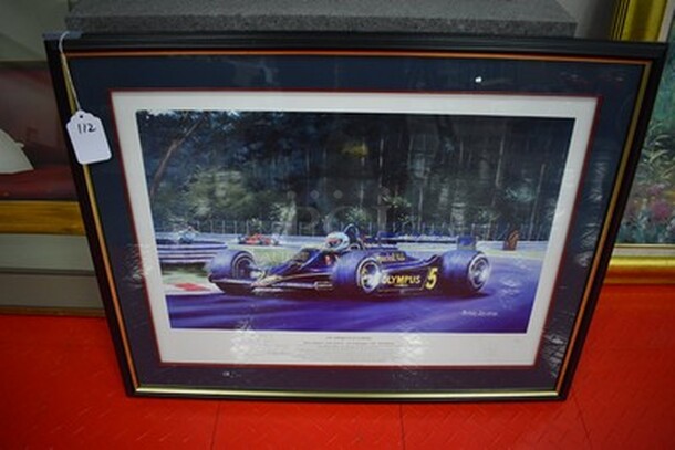 STUNNING! Benoit Deliege "An American In Europe Painting" Mario Andretti Lotus Ford 79. Autographed By Benoit Deliege and Mario Andretti!. 30x1x23. - Image 1 of 5