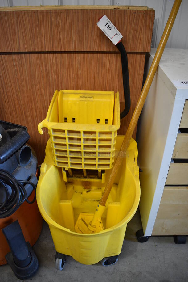 Yellow Poly Mop Bucket w/ Wringing Attachment and Mop Handle on Casters. 15x20x36