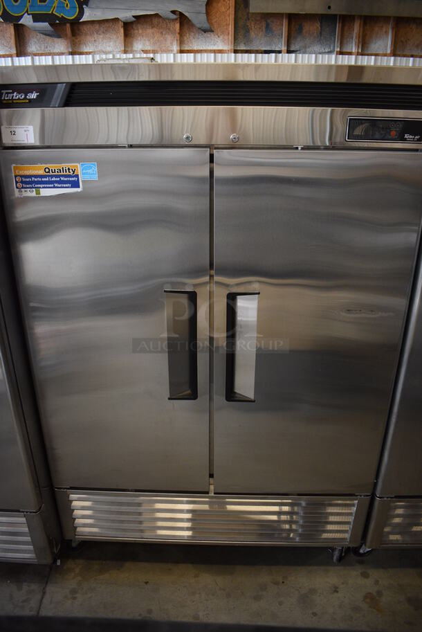 SWEET! 2012 Turbo Air Model TSR-49SD ENERGY STAR Stainless Steel Commercial 2 Door Reach In Cooler w/ Metal Racks on Commercial Casters. 110-120 Volts, 1 Phase. 55x30.5x83.5. Tested and Working!