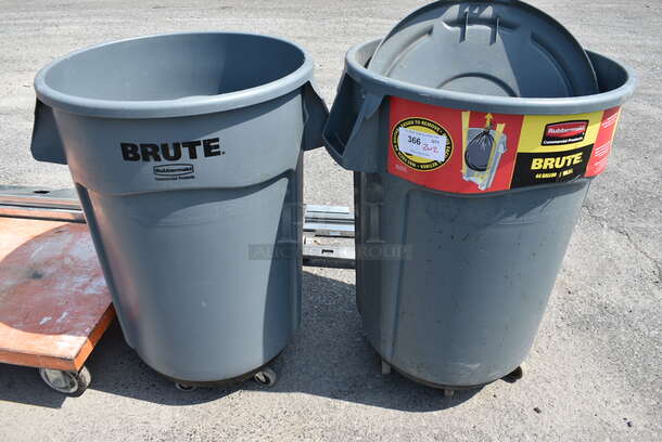 2 Rubbermaid Brute Gray Poly Trash Cans w/ 2 Lids on 2 Dollies. 28x24x36. 2 Times Your Bid!