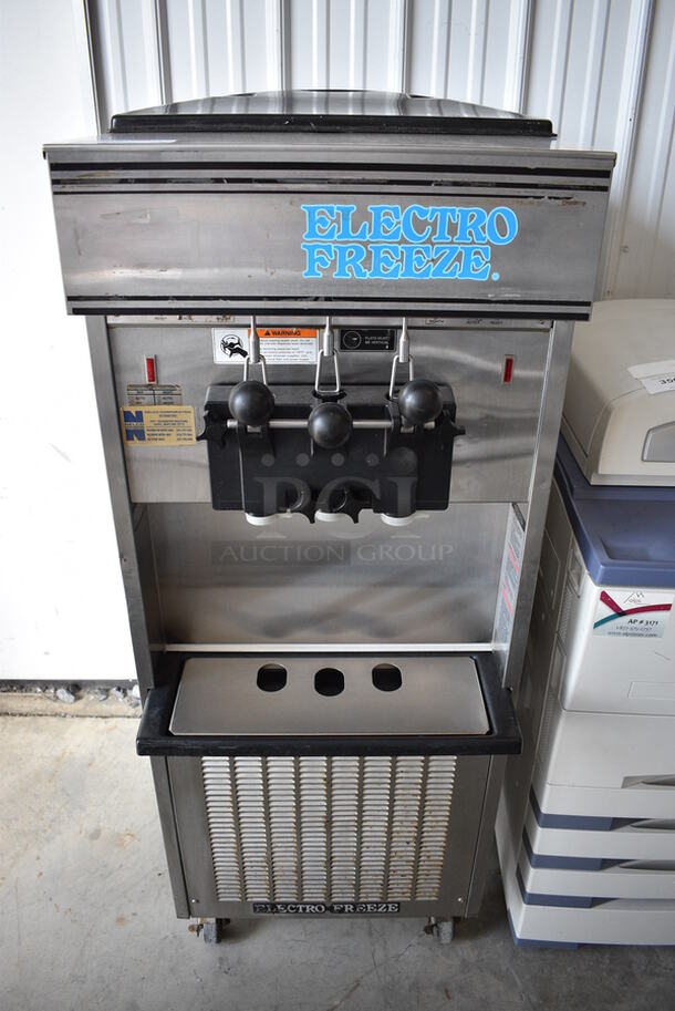GORGEOUS! 2011 Electro Freeze Model SL500-137 Stainless Steel Commercial Floor Style Water Cooled 2 Flavor w/ Twist Soft Serve Ice Cream Machine on Commercial Casters. 208-230 Volts, 1 Phase. 22x32x62