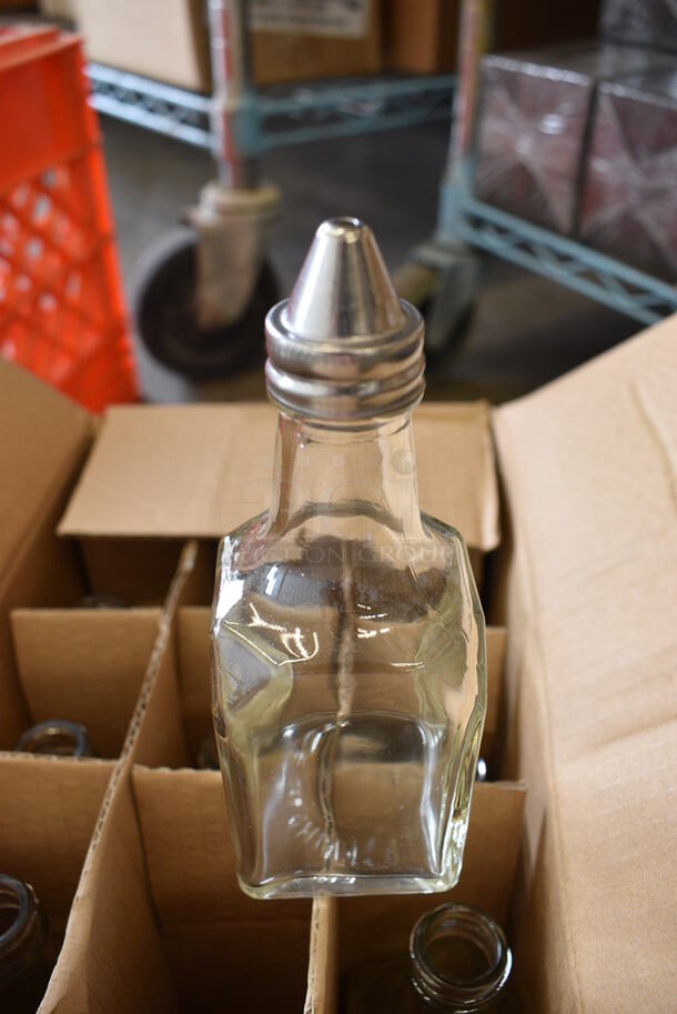 12 BRAND NEW IN BOX! Oil / Vinegar Glass Jars. 2x2x6. 12 Times Your Bid!