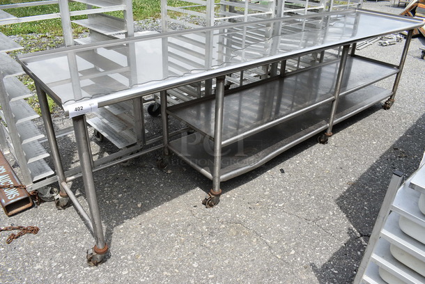 Stainless Steel Commercial Table w/ 2 Metal Undershelves on Commercial Casters. 124x27x35