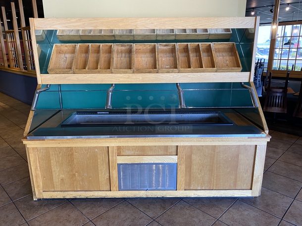 BEAUTIFUL!! Delfield N8182-FA, Forced Air Cold Pan Drop-In Unit. In Perfect Working Order. Unit holds up to (6) 12x20 Pans, 3/4 HP, 14.8Amp, 115v, 5-20 Nema Plug.     Lot Consists of: Solid Wood Serving Station, Free Standing Produce Bar with Forced Air Cold Pan Drop-In Unit on Commercial Casters, 3 Pane Glass Sneeze Guard Mounted Underneath Mirrored Angled Storage Shelf with 13 Stylish Open Top Wood Containers. Includes Extra Glass Panes. Delfield N8182-FA, Forced Air Cold Pan Drop-In Unit - 82.25” x 26.67” x 28.62” - hold up to (6) 12x20 Pans, 3/4 HP, 14.8Amp, 115v, 5-20 Nema Plug. Produce Bar is plated with stainless steel to protect the wood surface and allow for ease in sliding tray and cleaning. Overall dimensions: 103-1/2x44x72 Produce Bar/Cabinet: 100x45-1/2x33.  This piece is located on site in Modesto, CA. Shipping or Pick-Up Available. Winning Bidder must Contact PCI Auctions Southwest by 26-AUG-2020 with Arrangements for pick-up or shipping. Pick-Up for this items will not 