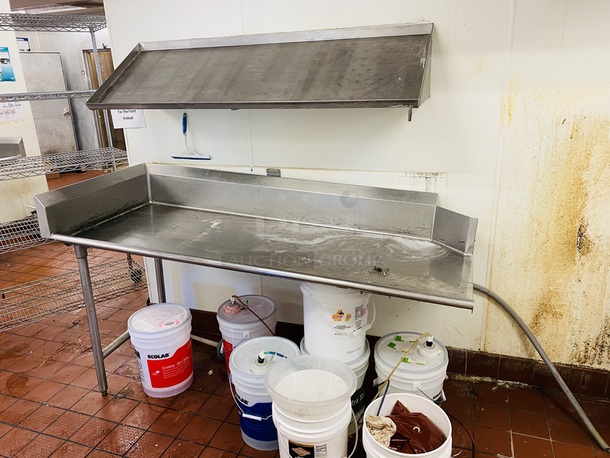 AMAZING! Wall Mount Angled Drying Shelf & Left Side Pass-Thru Dishwasher Clean Table, Stainless Steel. Shelf: 60x18x12 Table: 72x30x42-1/2.    This lot is on-site in Modesto, CA. Pick Up for this item is avaialble the weeknd of 28-AUG-2020. The Winning Bidder must contact PCI Auctions Southwest by 26-AUG-2020 to Arrange Pick-Up or Shipping.    2x Your Bid