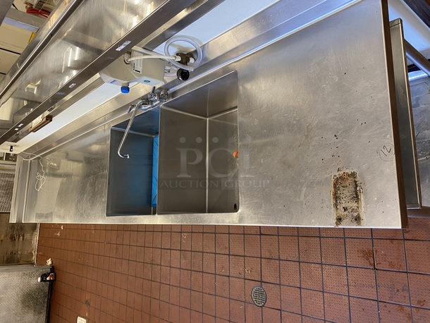 BEAUTIFUL! Stainless Steel Prep Station/Table with 2 Compartment Prep Sink  13' -0"x30"x41", all welded construction, NSF. 16 gauge, 304 stainless steel top w/6" backsplash, 18 gauge, stainless steel undershelf, stainless steel legs and adjustable stainless steel feet. with 2 (LARGE) Bay Sink, Faucet, Plumbing, Storage Drawer and Under-shelf. 13ft x 30" x 41 inches (to top of backsplash).   B-2424 Fabricated sink bowl, 24" front-to-back x 24" Wide x 12" Deep, 14 gauge, 304 stainless steel.  Roller bearing drawer, 20" x 20", stainless steel removable pan.  (2) Twist Handle Lever drains, 2" drain outlet        This piece is located on site in Modesto, CA. Shipping or Pick-Up Available. Winning Bidder must Contact PCI Auctions Southwest by 26-AUG-2020 with Arrangements for pick-up or shipping. Pick-Up for this items will not be until the weekend of 28-AUG-2020. - Image 2 of 5