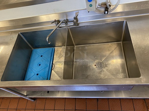 BEAUTIFUL! Stainless Steel Prep Station/Table with 2 Compartment Prep Sink  13' -0"x30"x41", all welded construction, NSF. 16 gauge, 304 stainless steel top w/6" backsplash, 18 gauge, stainless steel undershelf, stainless steel legs and adjustable stainless steel feet. with 2 (LARGE) Bay Sink, Faucet, Plumbing, Storage Drawer and Under-shelf. 13ft x 30" x 41 inches (to top of backsplash).   B-2424 Fabricated sink bowl, 24" front-to-back x 24" Wide x 12" Deep, 14 gauge, 304 stainless steel.  Roller bearing drawer, 20" x 20", stainless steel removable pan.  (2) Twist Handle Lever drains, 2" drain outlet        This piece is located on site in Modesto, CA. Shipping or Pick-Up Available. Winning Bidder must Contact PCI Auctions Southwest by 26-AUG-2020 with Arrangements for pick-up or shipping. Pick-Up for this items will not be until the weekend of 28-AUG-2020. - Image 3 of 5