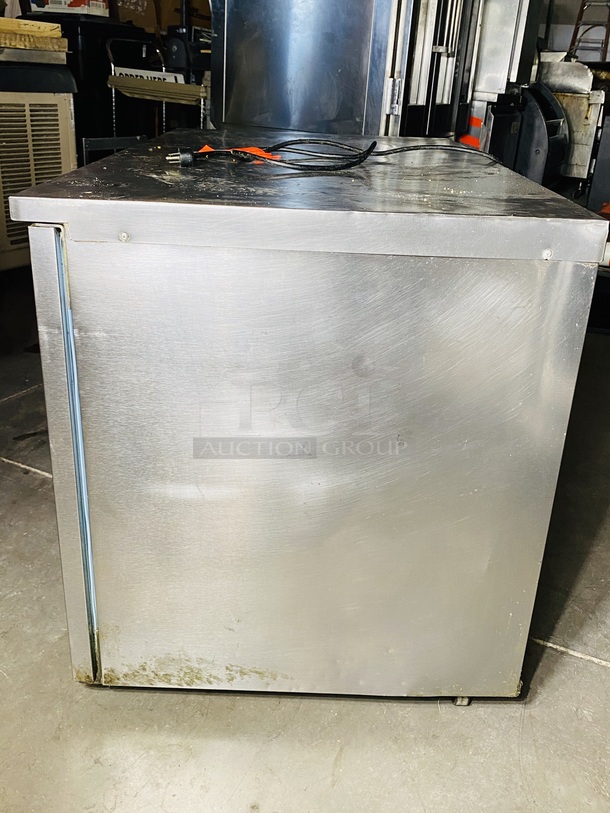 Delfield Model No. UC4048, Undercounter Refrigerator, two-section, 48"W, 11.4 cu. ft, (2) doors, stainless steel top, front & sides, 6" legs, rear-mounted, self-contained refrigeration, 1/5 hp. 115v/60/1-ph, NEMA 5-15P std. On Commercial Casters

In use until Removal. Tested. Turned on. Temp got down to 40 degrees.  - Image 5 of 5