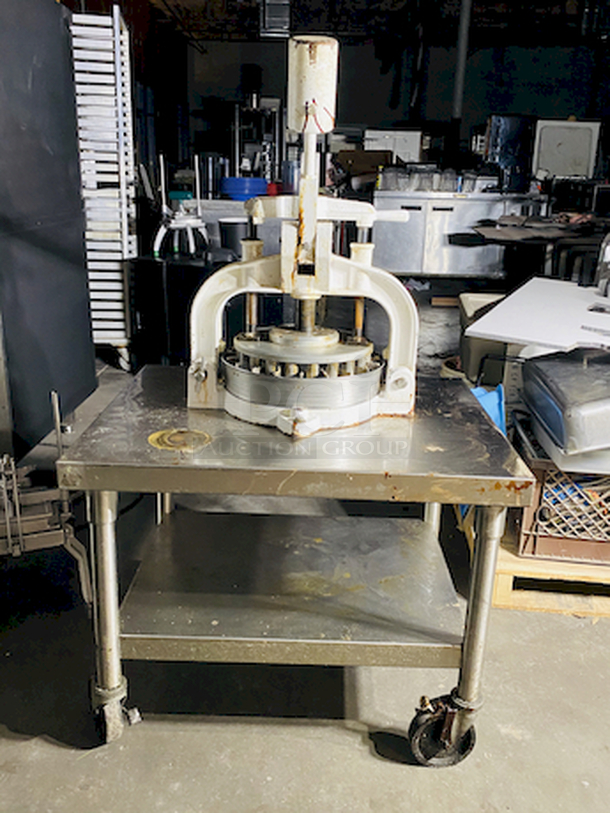 CRÈME DE LA CRÈME! Dough Divider/Rounder by Oliver - Model No. 623-N and Equipment Stand Model No. 2SU-30 on Commercial Casters.        This lot consists of: Bun Divider, hand operated, cast iron & cast aluminum construction, 36 part up to 4 oz., std. - Price New: $1580        Equipment stand: 30x30x24, 14 gauge, all welded construction, NSF. 304 stainless steel top with turned down edges, 18 gauge stainless steel undershelf and 16 gauge stainless steel legs and adjustable stainless steel feet. - Price New: $580        2x Your Bid - Image 11 of 12
