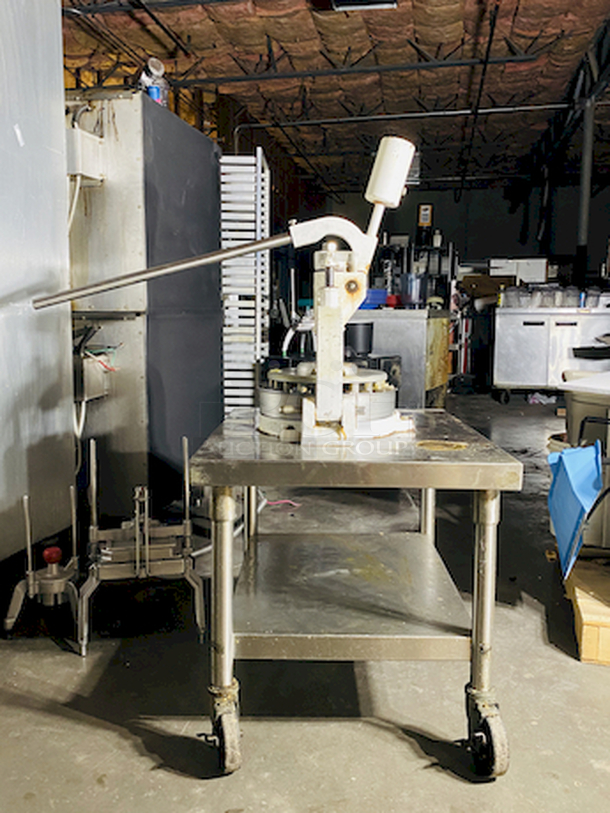 CRÈME DE LA CRÈME! Dough Divider/Rounder by Oliver - Model No. 623-N and Equipment Stand Model No. 2SU-30 on Commercial Casters.        This lot consists of: Bun Divider, hand operated, cast iron & cast aluminum construction, 36 part up to 4 oz., std. - Price New: $1580        Equipment stand: 30x30x24, 14 gauge, all welded construction, NSF. 304 stainless steel top with turned down edges, 18 gauge stainless steel undershelf and 16 gauge stainless steel legs and adjustable stainless steel feet. - Price New: $580        2x Your Bid - Image 10 of 12