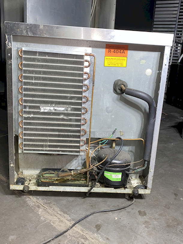 DON'T MISS OUT! Delfield Model No. 406 27" Undercounter Refrigerator, single-section on Commercial Casters.  Tested. Turns On. Quickly Gets Down To and Holds Temperature. 115v/60/1-ph, NEMA 5-15P std. 27"W, 5.7 cu. ft, (1) right han hinged door, stainless steel top, front & sides, ABS interior, 6" legs, rear-mounted refrigeration system, 1/5 hp, 2" NSF certified casters (set of four 2/locking) for undercounter applications - Image 4 of 8