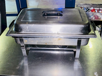 BEAUTIFUL! 8 Qt. Full Size Stainless Steel Chafer. 24x14-1/8x13
Includes: Full size chafer frame, 4" deep water pan, 2 1/2" deep food pan, 2 1/2" high lid with black handle, Fuel holder tray
