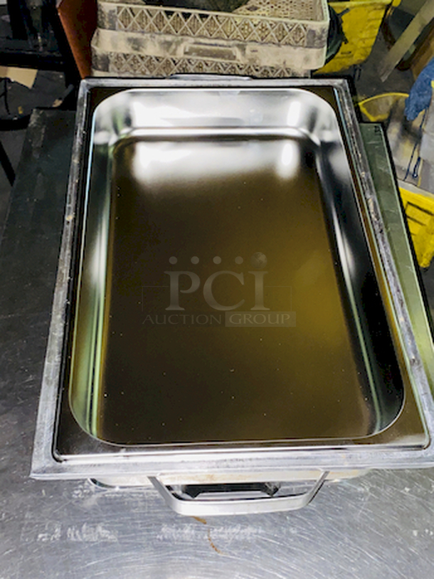 BEAUTIFUL! 8 Qt. Full Size Stainless Steel Chafer. 24x14-1/8x13
Includes: Full size chafer frame, 4" deep water pan, 2 1/2" deep food pan, 2 1/2" high lid with black handle, Fuel holder tray
 - Image 3 of 7