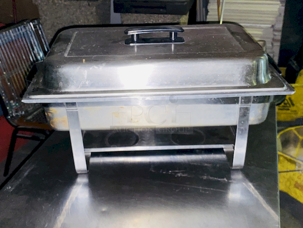 BEAUTIFUL! 8 Qt. Full Size Stainless Steel Chafer. 24x14-1/8x13
Includes: Full size chafer frame, 4" deep water pan, 2 1/2" deep food pan, 2 1/2" high lid with black handle, Fuel holder tray
 - Image 6 of 7