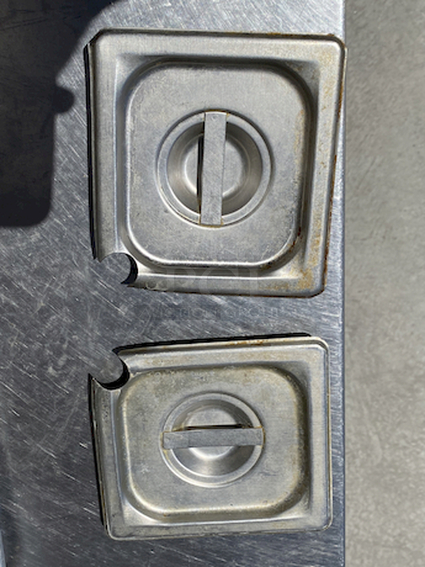 POCKET ACES! Pair of Stainless Steel 1/6 Pan lids with Ladle Cutout. 

2x Your Bid - Image 1 of 1