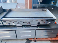BUILT FOR HEAVY DUTY & HEAVY USE! Vulcan MSA-60-101 60" Countertop Natural Gas Griddle with Snap-Action Thermostatic Controls - 135,000 BTU.

Width	60 Inches
Depth	31 1/2 Inches
Height	15 1/4 Inches
Cooking Surface Width	60 Inches
Cooking Surface Depth	24 Inches

Stainless steel front, sides and front top ledge. Fully welded stainless and aluminized steel body frame. 11" low profile cooking height on 4" legs. 1" thick polished steel griddle plate with 12 gage, 4" stainless steel back and tapered side splashes. Grease chute is fully welded to stop grease migration. One 27,000 BTU/hr. “U” shaped aluminized steel burner and mechanical snap action thermostat for each 12" of griddle width. Chrome thermostat knob guards. Temperature adjusts from 200° to 550° F. One pilot safety for every two burners.