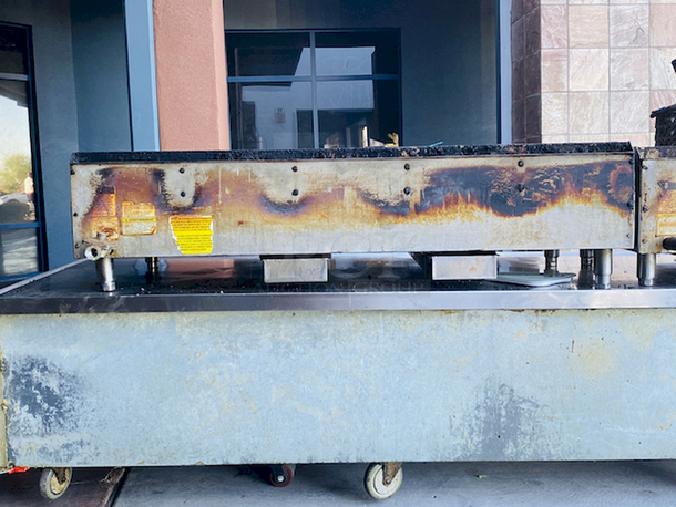 BUILT FOR HEAVY DUTY & HEAVY USE! Vulcan MSA-60-101 60" Countertop Natural Gas Griddle with Snap-Action Thermostatic Controls - 135,000 BTU.

Width	60 Inches
Depth	31 1/2 Inches
Height	15 1/4 Inches
Cooking Surface Width	60 Inches
Cooking Surface Depth	24 Inches

Stainless steel front, sides and front top ledge. Fully welded stainless and aluminized steel body frame. 11" low profile cooking height on 4" legs. 1" thick polished steel griddle plate with 12 gage, 4" stainless steel back and tapered side splashes. Grease chute is fully welded to stop grease migration. One 27,000 BTU/hr. “U” shaped aluminized steel burner and mechanical snap action thermostat for each 12" of griddle width. Chrome thermostat knob guards. Temperature adjusts from 200° to 550° F. One pilot safety for every two burners. - Image 6 of 10