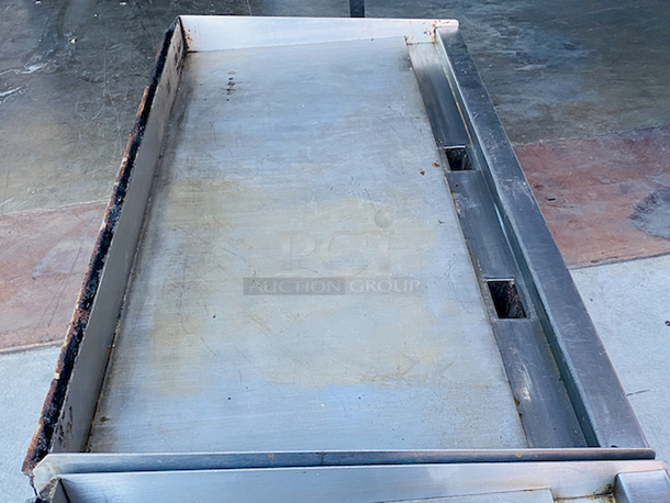 BUILT FOR HEAVY DUTY & HEAVY USE! Vulcan MSA-60-101 60" Countertop Natural Gas Griddle with Snap-Action Thermostatic Controls - 135,000 BTU.

Width	60 Inches
Depth	31 1/2 Inches
Height	15 1/4 Inches
Cooking Surface Width	60 Inches
Cooking Surface Depth	24 Inches

Stainless steel front, sides and front top ledge. Fully welded stainless and aluminized steel body frame. 11" low profile cooking height on 4" legs. 1" thick polished steel griddle plate with 12 gage, 4" stainless steel back and tapered side splashes. Grease chute is fully welded to stop grease migration. One 27,000 BTU/hr. “U” shaped aluminized steel burner and mechanical snap action thermostat for each 12" of griddle width. Chrome thermostat knob guards. Temperature adjusts from 200° to 550° F. One pilot safety for every two burners. - Image 7 of 10