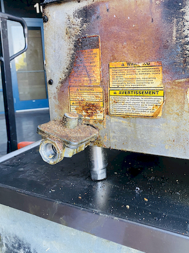 BUILT FOR HEAVY DUTY & HEAVY USE! Vulcan MSA-60-101 60" Countertop Natural Gas Griddle with Snap-Action Thermostatic Controls - 135,000 BTU.

Width	60 Inches
Depth	31 1/2 Inches
Height	15 1/4 Inches
Cooking Surface Width	60 Inches
Cooking Surface Depth	24 Inches

Stainless steel front, sides and front top ledge. Fully welded stainless and aluminized steel body frame. 11" low profile cooking height on 4" legs. 1" thick polished steel griddle plate with 12 gage, 4" stainless steel back and tapered side splashes. Grease chute is fully welded to stop grease migration. One 27,000 BTU/hr. “U” shaped aluminized steel burner and mechanical snap action thermostat for each 12" of griddle width. Chrome thermostat knob guards. Temperature adjusts from 200° to 550° F. One pilot safety for every two burners. - Image 10 of 10
