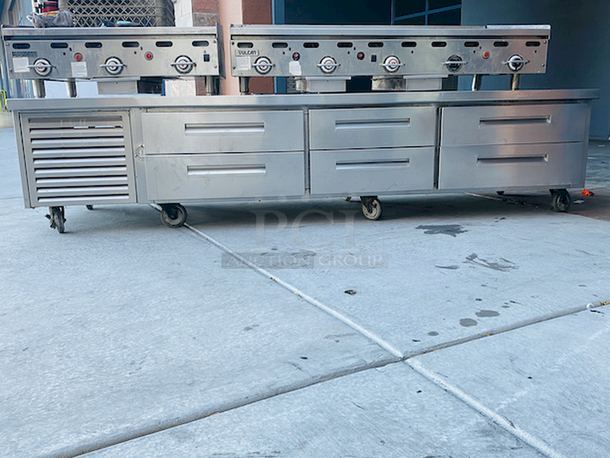 AMAZING! 6 Drawer Refrigerated Chef Base! Observed in perfect working order. 115v. On Commercial Casters. Width: 96" Depth: 34 1/8"
Height: 26".

6 drawers; each holds (2) 12" x 20" x 6" food pans
3" casters with adjustable channels; maximum top capacity of 1500 lb.
Stainless steel construction; side, front, and rear access panels - Image 1 of 10