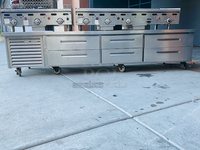 AMAZING! 6 Drawer Refrigerated Chef Base! Observed in perfect working order. 115v. On Commercial Casters. Width: 96" Depth: 34 1/8"
Height: 26".

6 drawers; each holds (2) 12" x 20" x 6" food pans
3" casters with adjustable channels; maximum top capacity of 1500 lb.
Stainless steel construction; side, front, and rear access panels