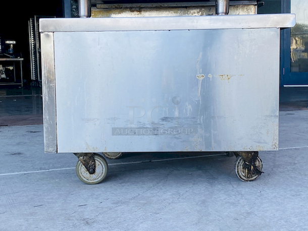 AMAZING! 6 Drawer Refrigerated Chef Base! Observed in perfect working order. 115v. On Commercial Casters. Width: 96" Depth: 34 1/8"
Height: 26".

6 drawers; each holds (2) 12" x 20" x 6" food pans
3" casters with adjustable channels; maximum top capacity of 1500 lb.
Stainless steel construction; side, front, and rear access panels - Image 2 of 10
