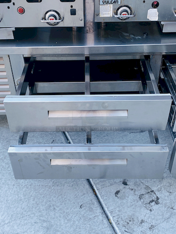 AMAZING! 6 Drawer Refrigerated Chef Base! Observed in perfect working order. 115v. On Commercial Casters. Width: 96" Depth: 34 1/8"
Height: 26".

6 drawers; each holds (2) 12" x 20" x 6" food pans
3" casters with adjustable channels; maximum top capacity of 1500 lb.
Stainless steel construction; side, front, and rear access panels - Image 6 of 10