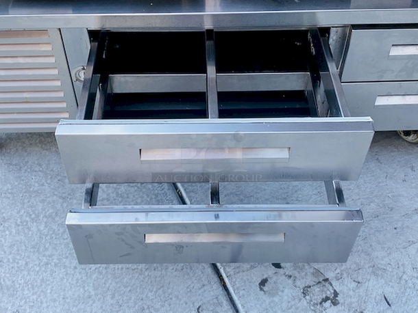 AMAZING! 6 Drawer Refrigerated Chef Base! Observed in perfect working order. 115v. On Commercial Casters. Width: 96" Depth: 34 1/8"
Height: 26".

6 drawers; each holds (2) 12" x 20" x 6" food pans
3" casters with adjustable channels; maximum top capacity of 1500 lb.
Stainless steel construction; side, front, and rear access panels - Image 9 of 10
