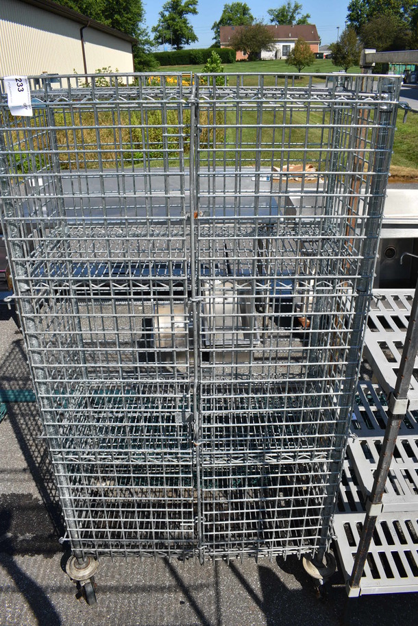 Chrome Finish 4 Tier Shelving Unit w/ Liquor Cage on Commercial Casters. 38x19x69. BUYER MUST DISMANTLE. PCI CANNOT  DISMANTLE FOR SHIPPING. PLEASE CONSIDER FREIGHT CHARGES. - Image 1 of 5