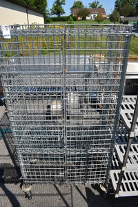 Chrome Finish 4 Tier Shelving Unit w/ Liquor Cage on Commercial Casters. 38x19x69. BUYER MUST DISMANTLE. PCI CANNOT  DISMANTLE FOR SHIPPING. PLEASE CONSIDER FREIGHT CHARGES.