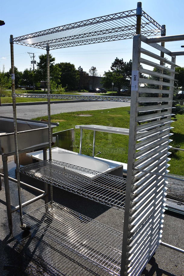 Chrome Finish 4 Tier Shelving Unit on Commercial Casters. 48x18x77. BUYER MUST DISMANTLE. PCI CANNOT  DISMANTLE FOR SHIPPING. PLEASE CONSIDER FREIGHT CHARGES. - Image 1 of 3