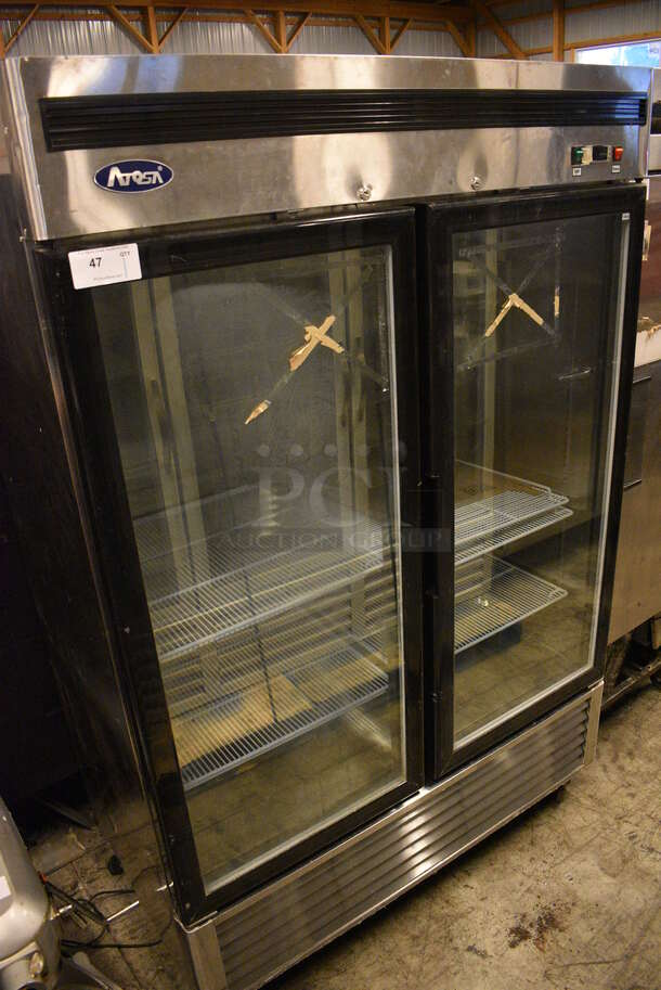 WOW! 2015 Atosa Model MCF8703 Stainless Steel Commercial 2 Door Reach In Freezer Merchandiser w/ Poly Coated Racks on Commercial Casters. 115 Volts, 1 Phase. 54x32x83. Tested and Powers On - Temps at 39 Degrees - Image 1 of 7