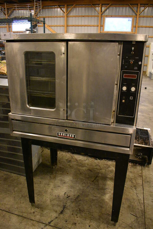 SWEET! Garland Model TE3 Stainless STeel Commercial Electric Powered Full Size Convection Oven w/ View Through Doors and Metal Oven Racks on Metal Legs. 208/230 Volts, 3 Phase. 40x29x65 - Image 1 of 6