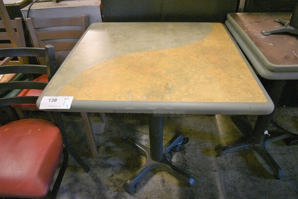 Tan and Green Table on Black Metal Table Base. Stock Picture - Cosmetic Condition May Vary. 30x30x30